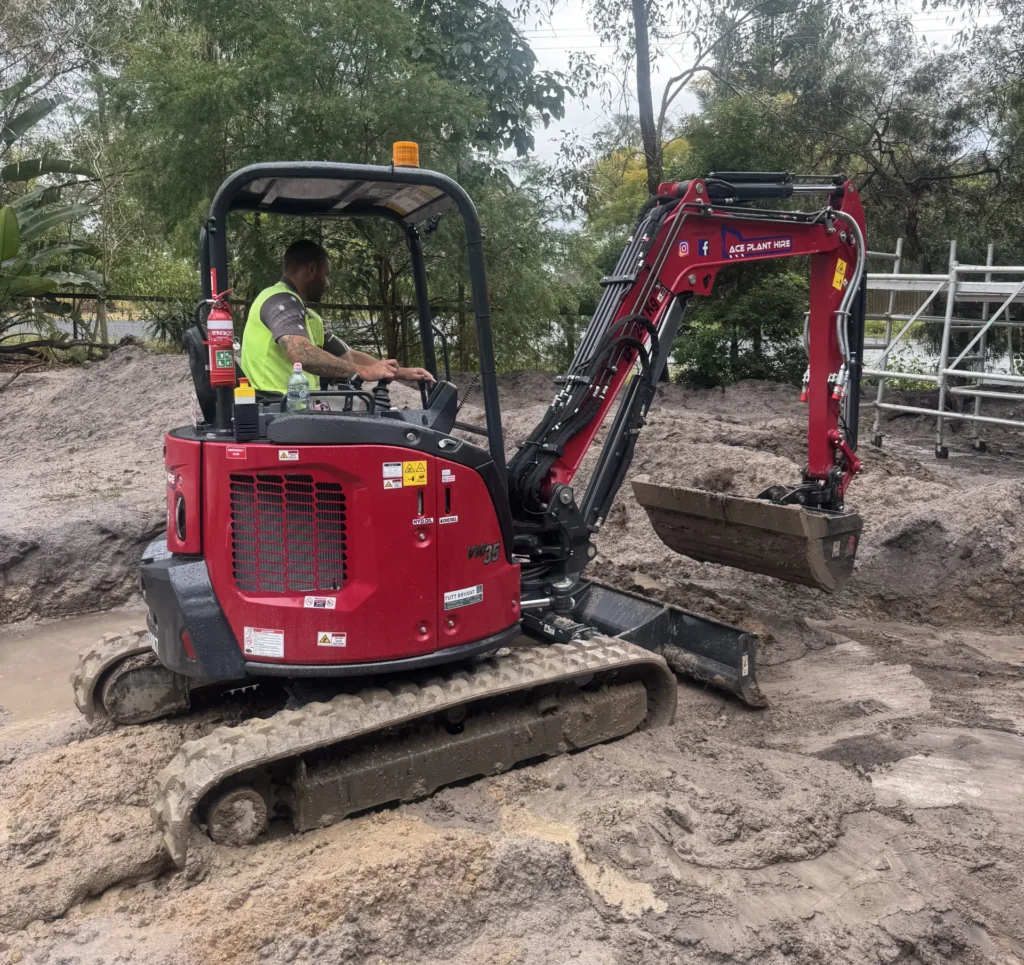 Ace Plant Hire operator running a mini excavator on a subcontractor worksite in Brisbane